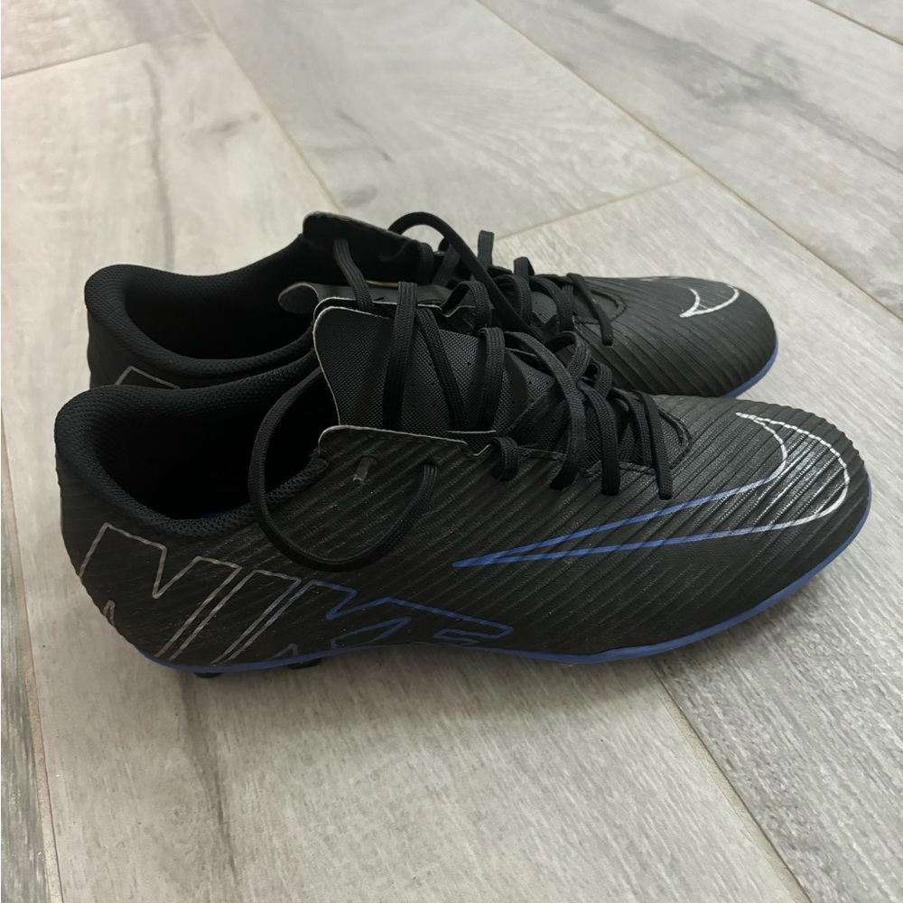 Nike Black and Blue Football Cleats with Sleek Design